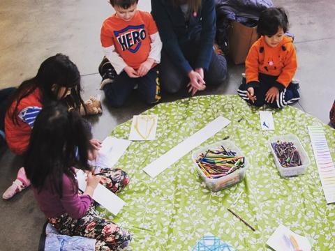 Children and parent making crafts