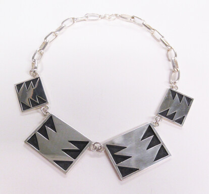 A necklace comprised of sterling squares.