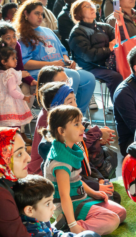 Families gather for an event in the Main Hall.